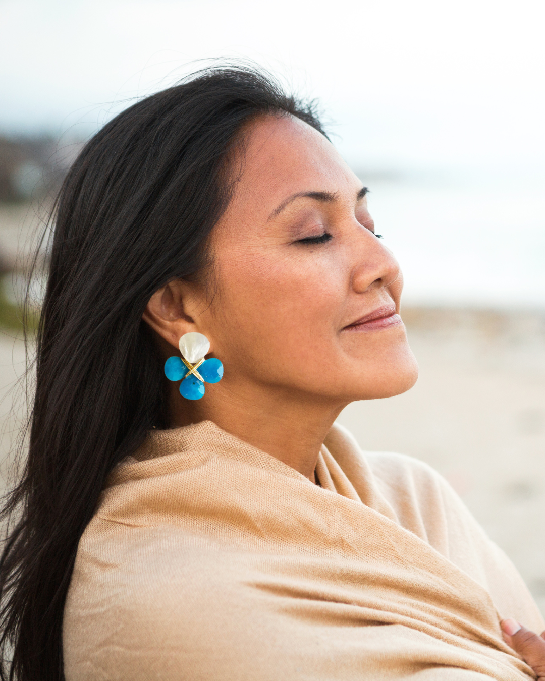 stud earrings on woman