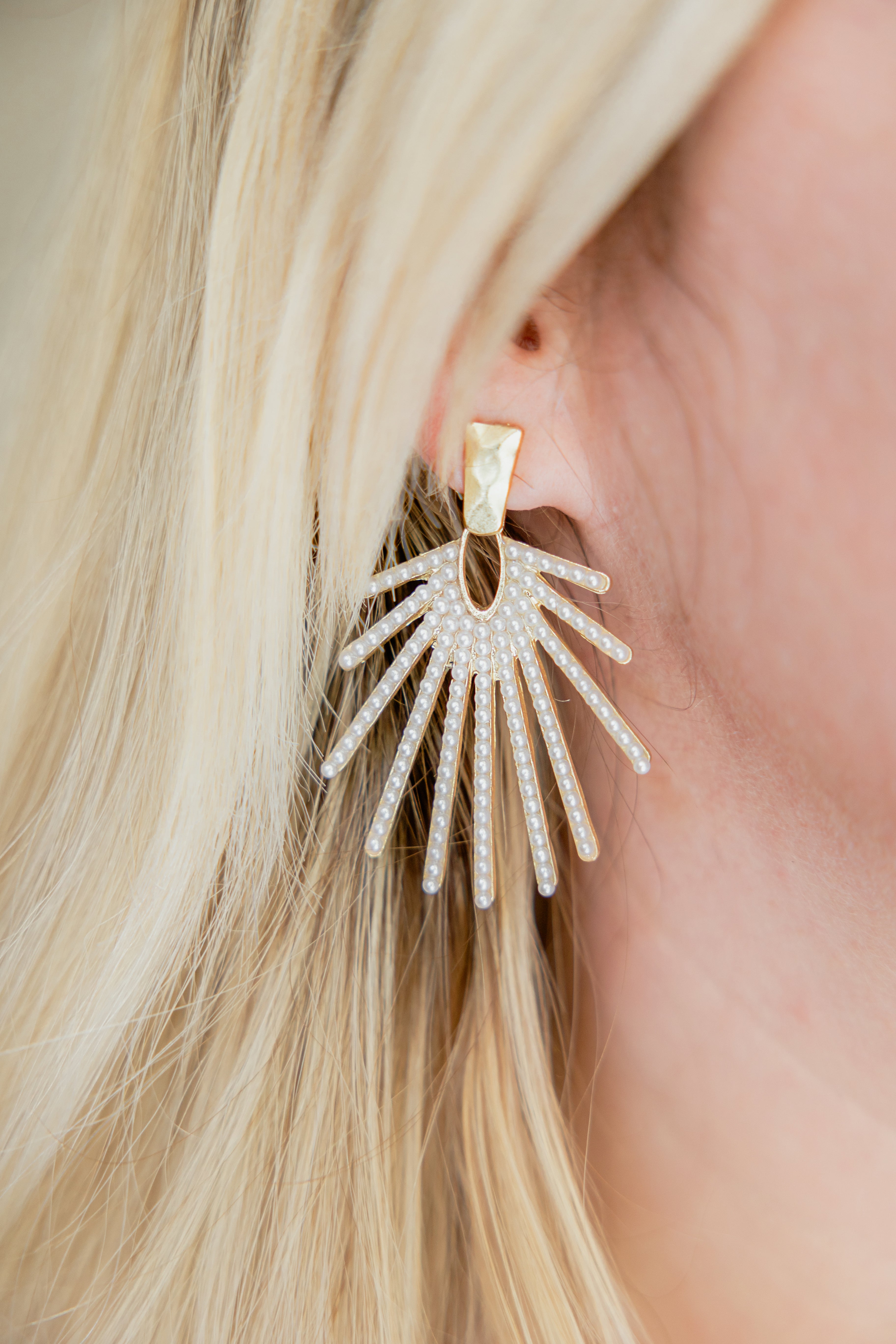 pearl dangle earrings modeled on woman