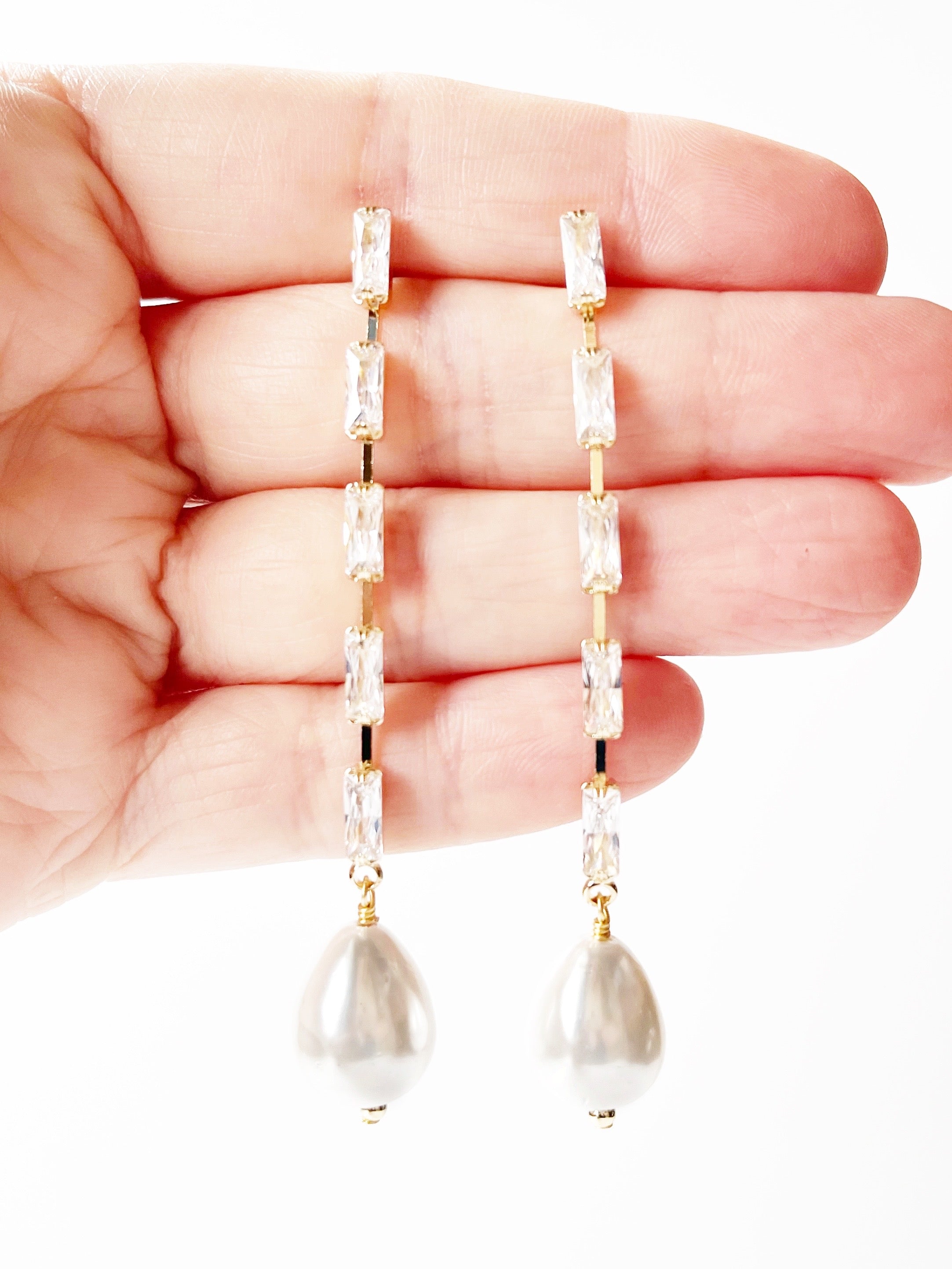 pearl drop earrings in gold