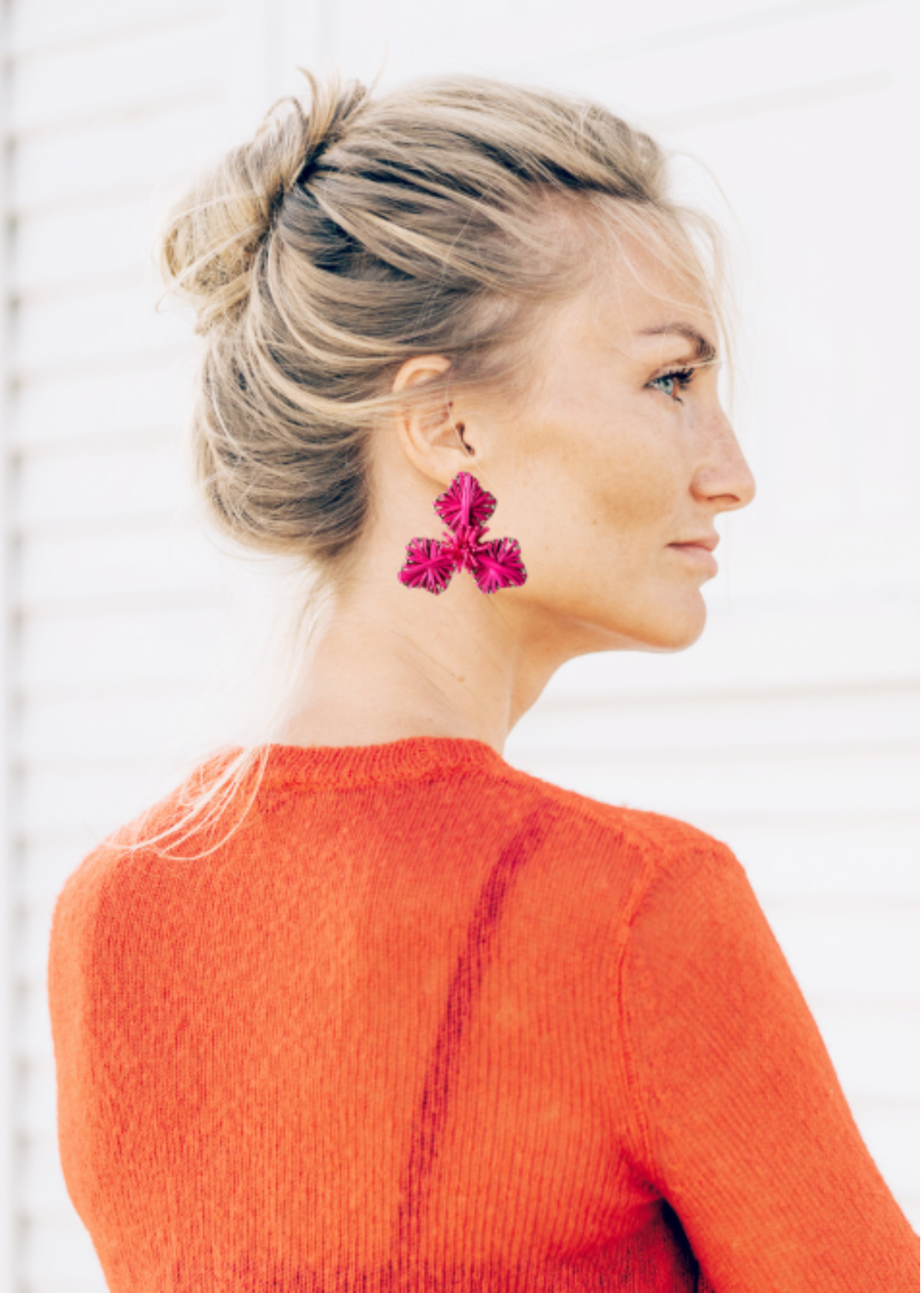 woman wearing flower earrings