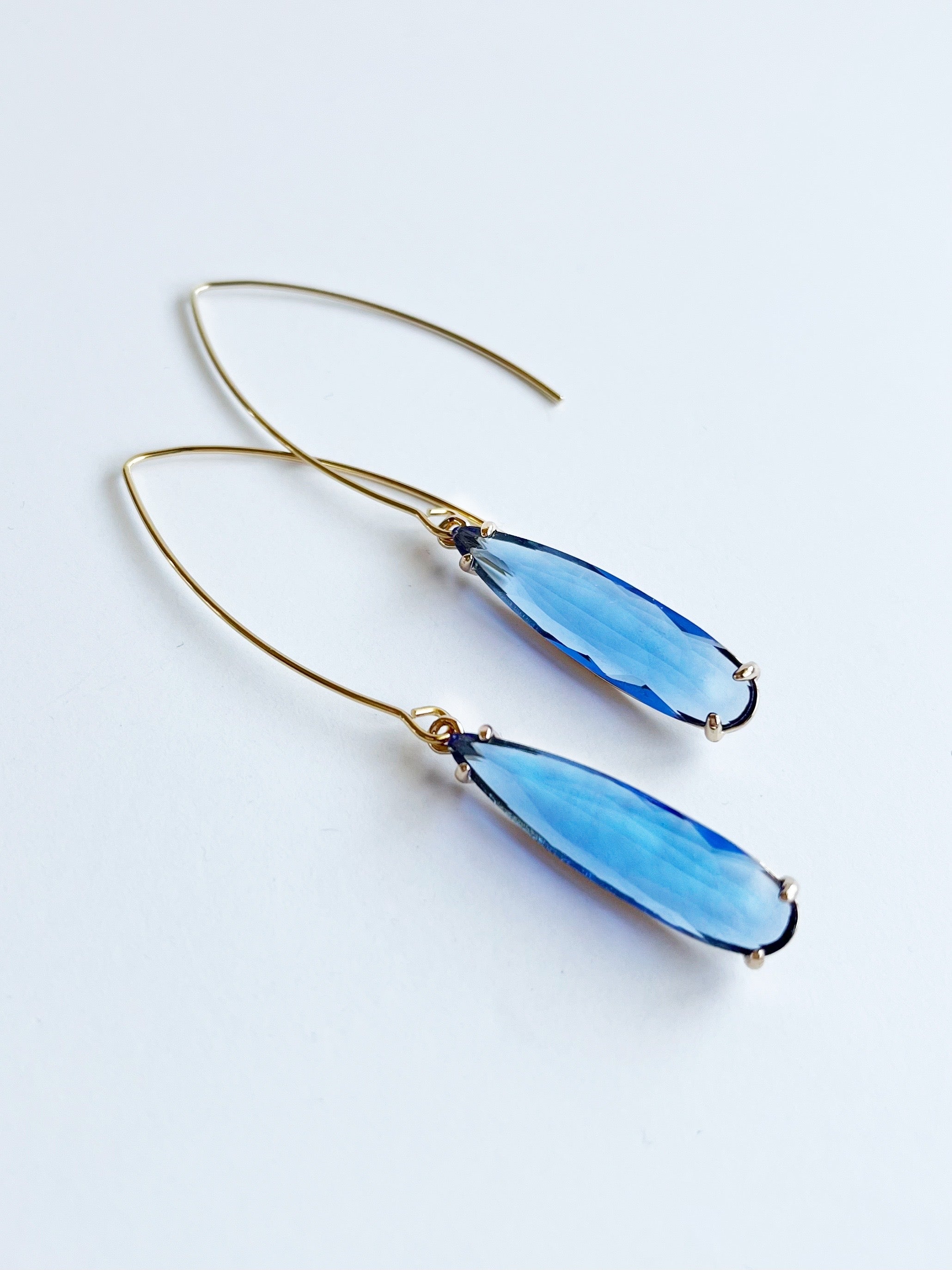blue teardrop earrings with gold setting