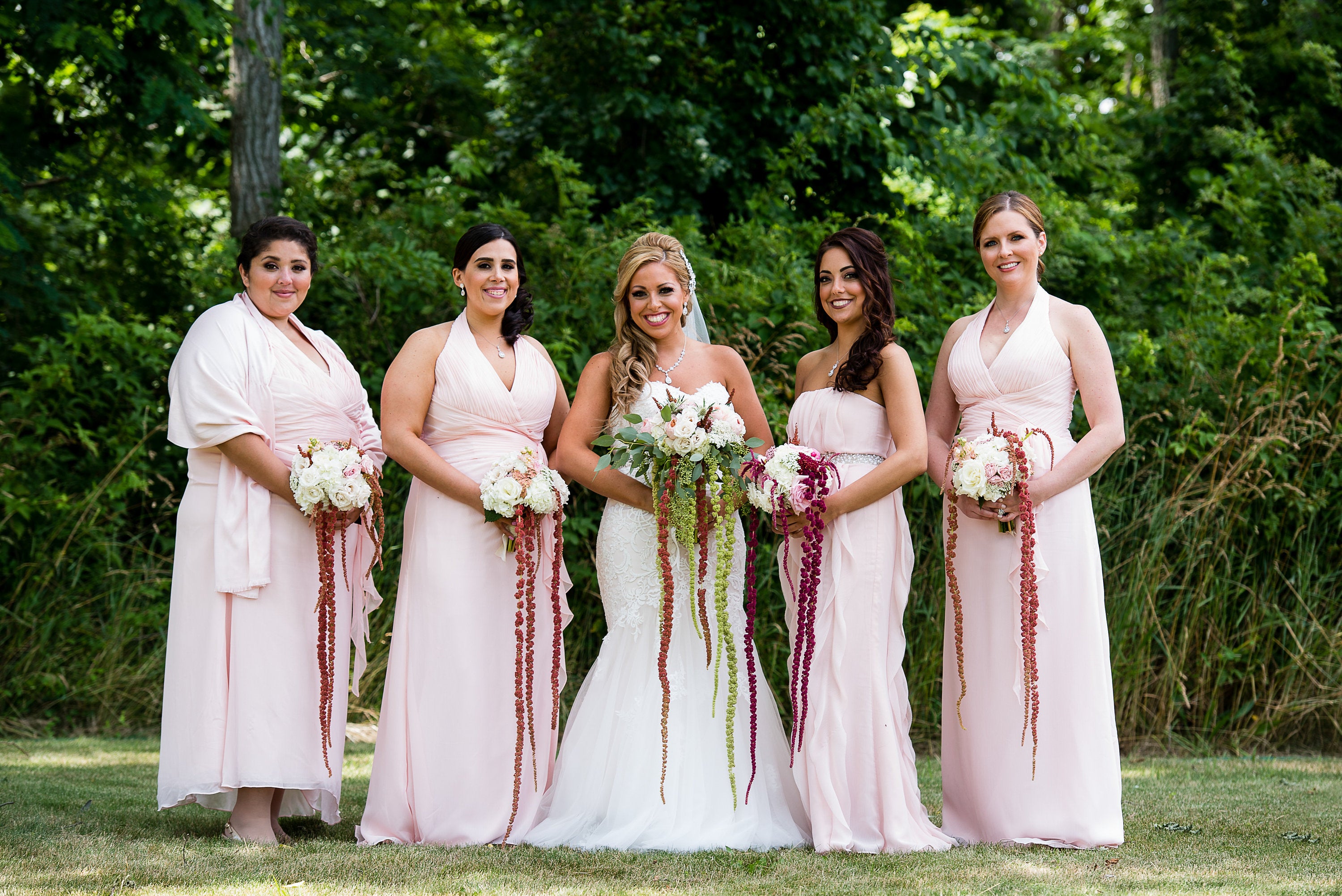 Bridal party wearing Teardrop cut cubic zirconia crystal with round oval accent set in silver color rhodium plated brass pendant necklace.