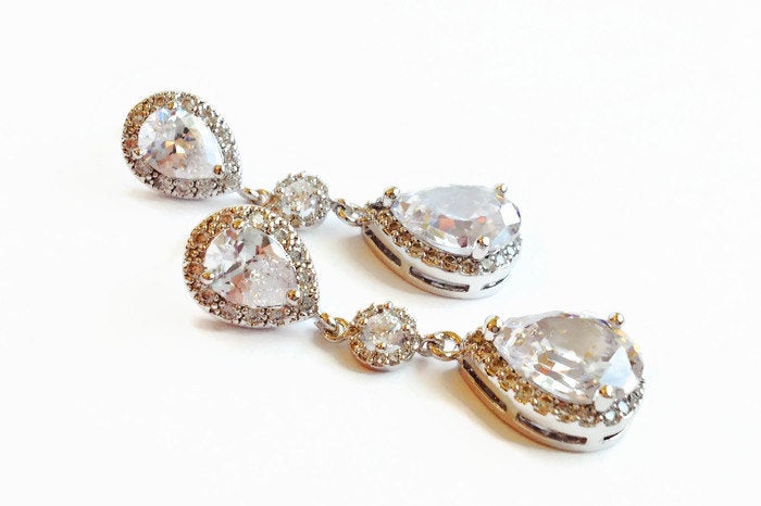 Long Crystal Cubic Zirconia Teardrop Earrings in a silver colored rhodium plated brass setting.