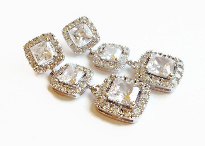 Long Square Cubic zirconia crystal wedding earrings in a silver colored rhodium plated brass setting