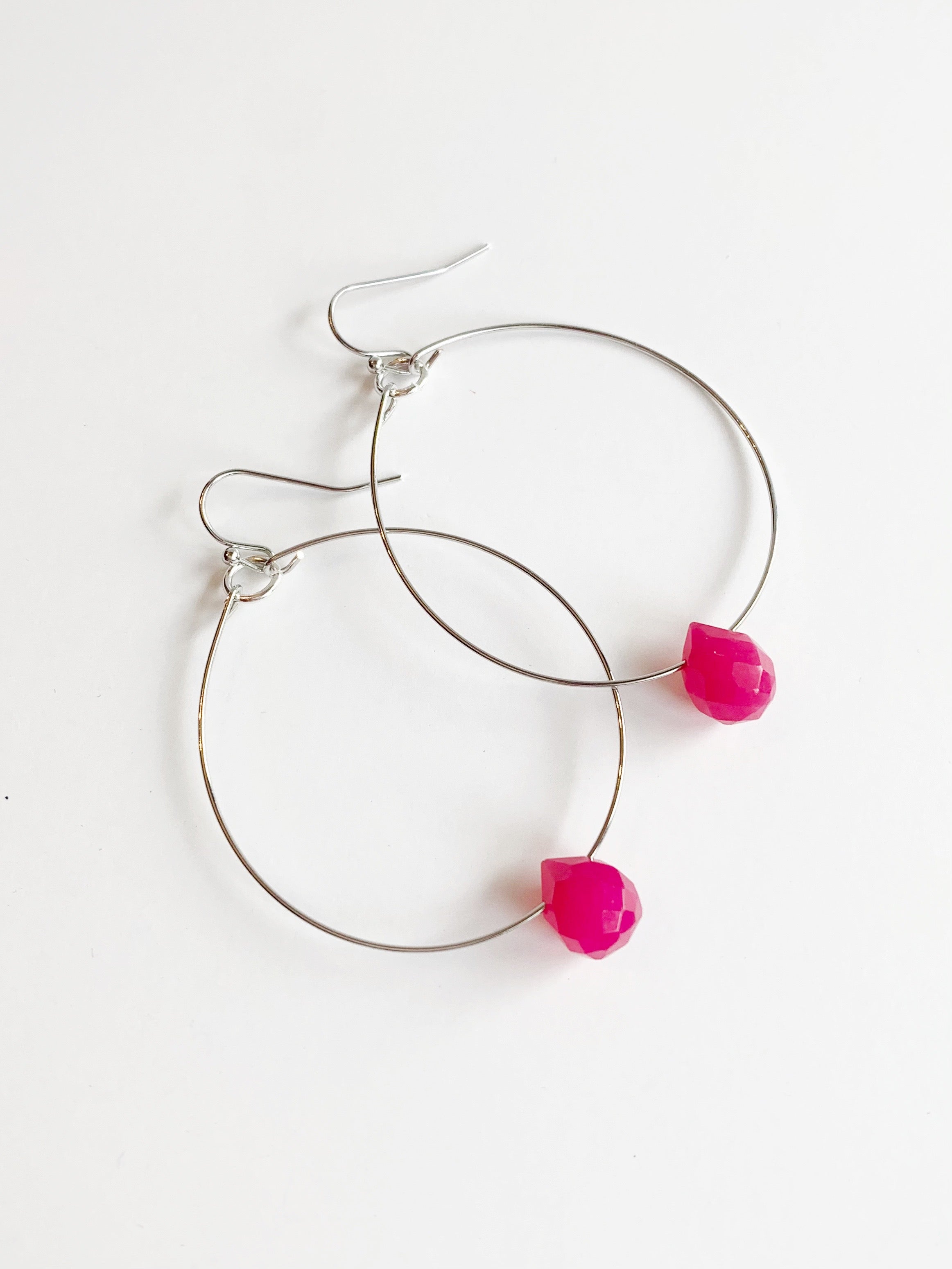 silver hoop earrings with pink accent bead