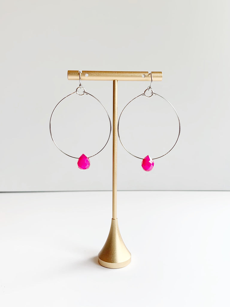 hoop earrings displayed on earring stand