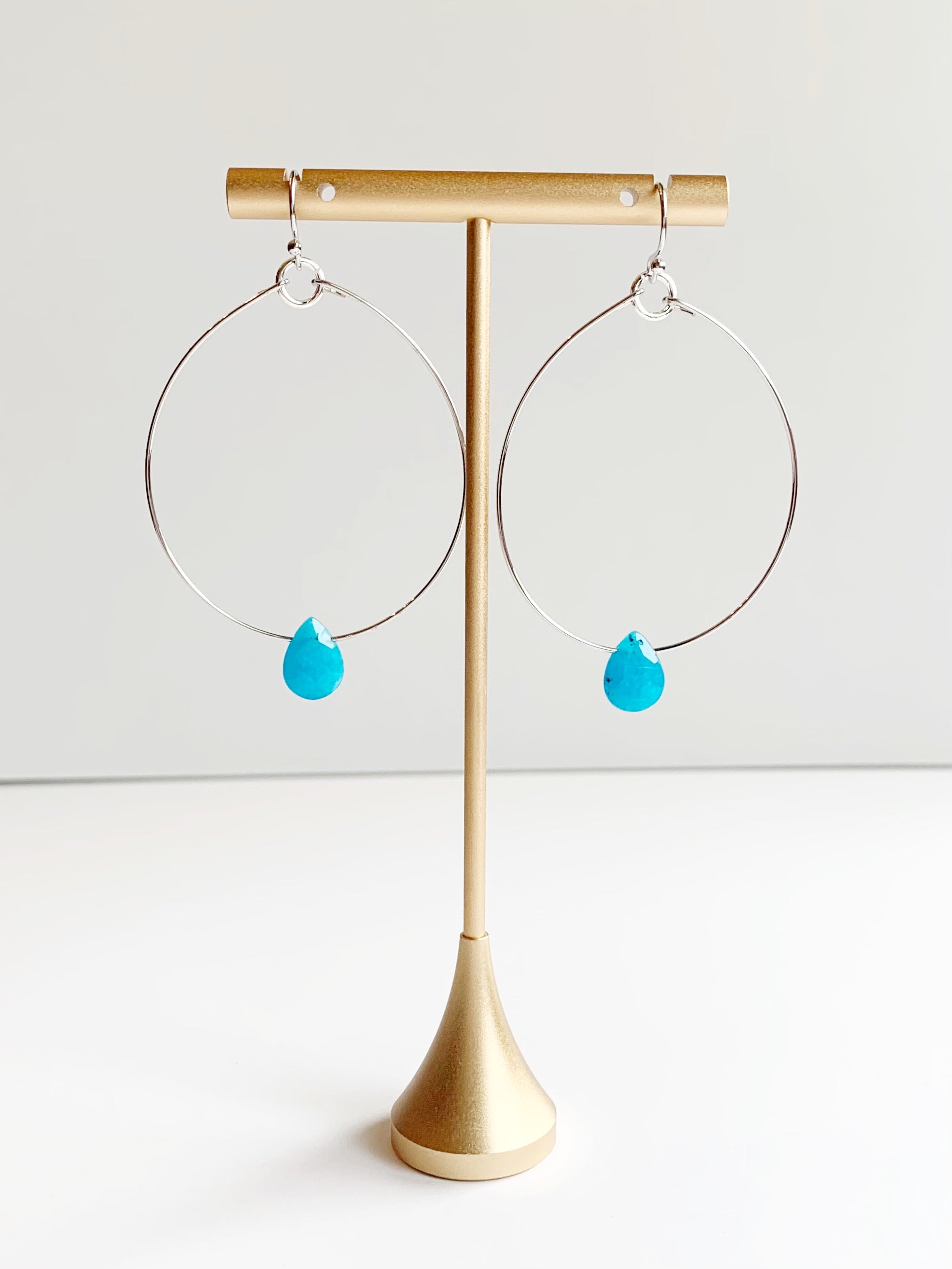 silver hoop earrings with blue bead