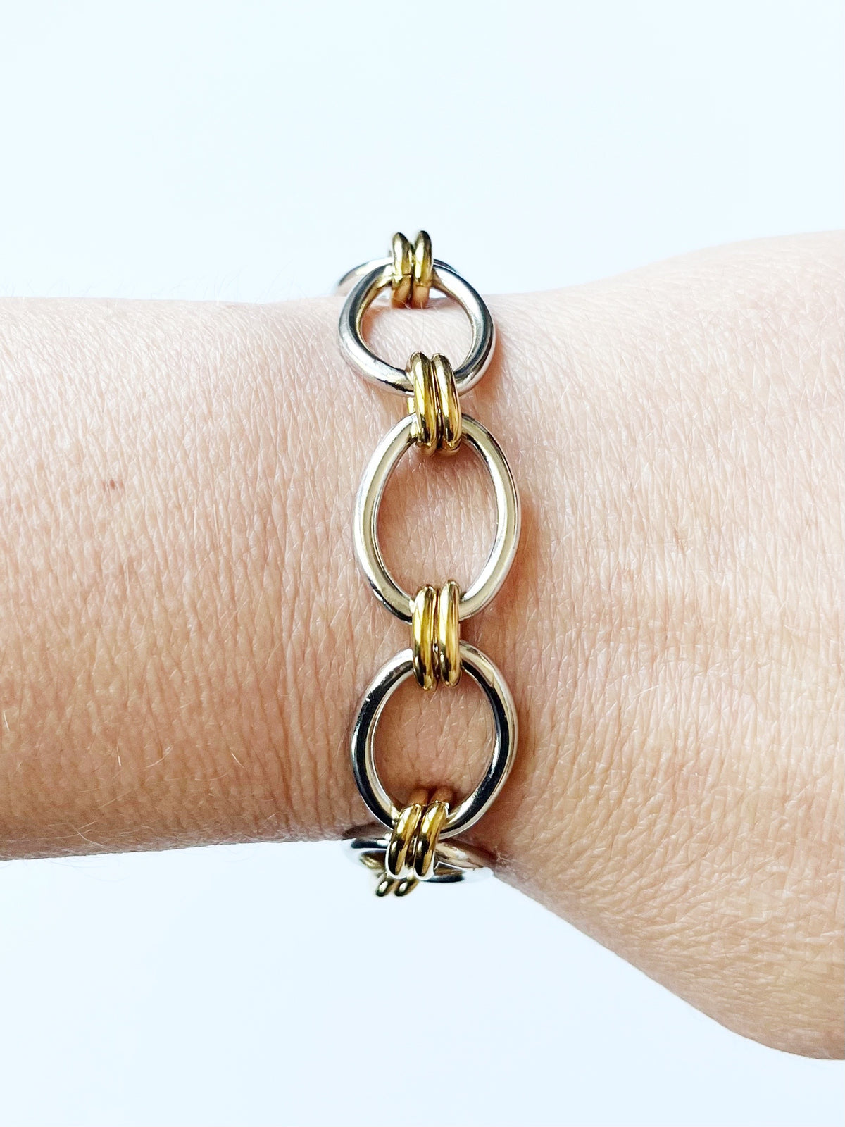 mixed metal chain bracelet on wrist