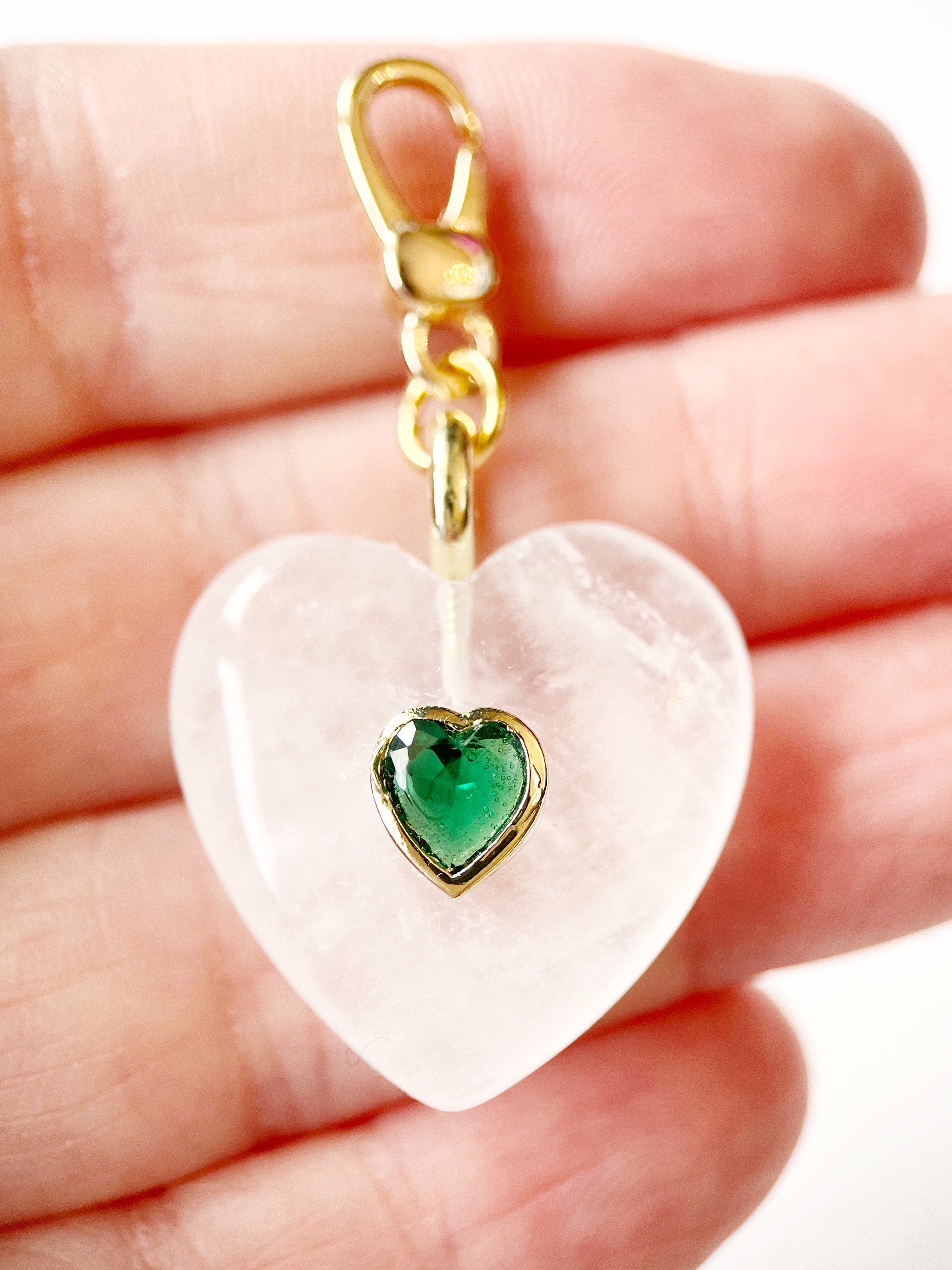 white heart charm with green crystal accent