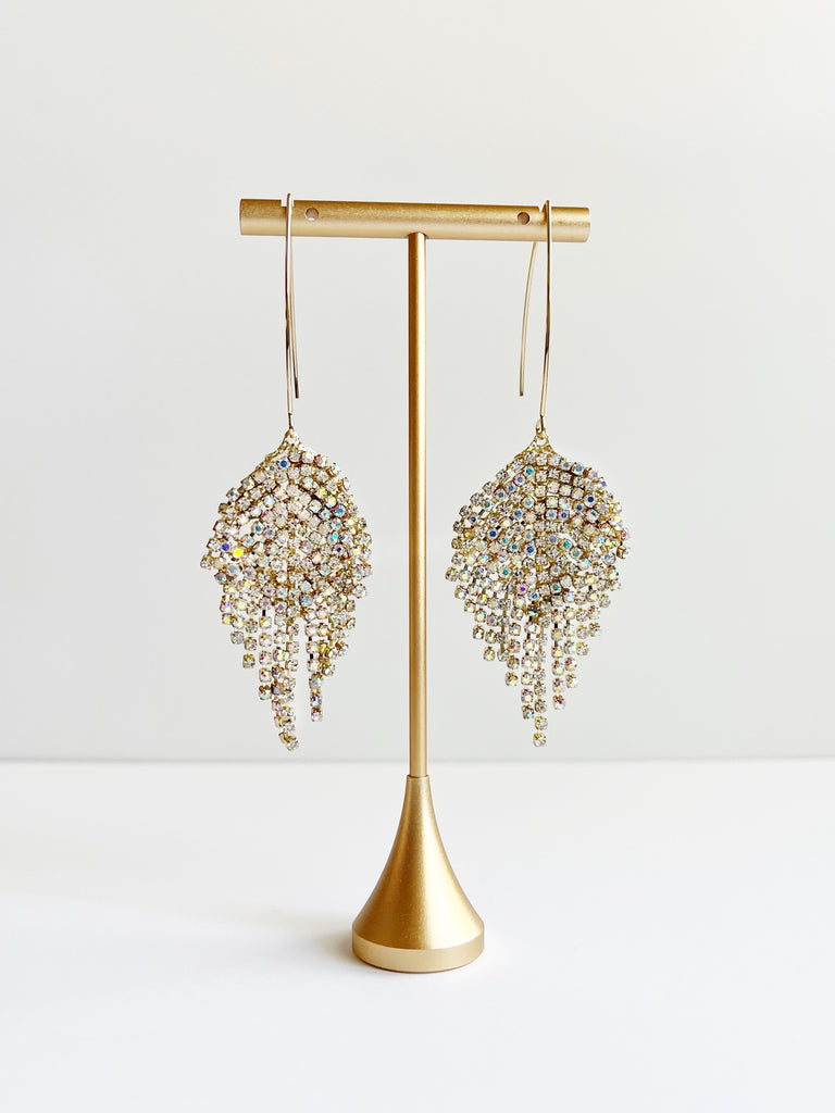 crystal and gold threader earrings on gold earring stand