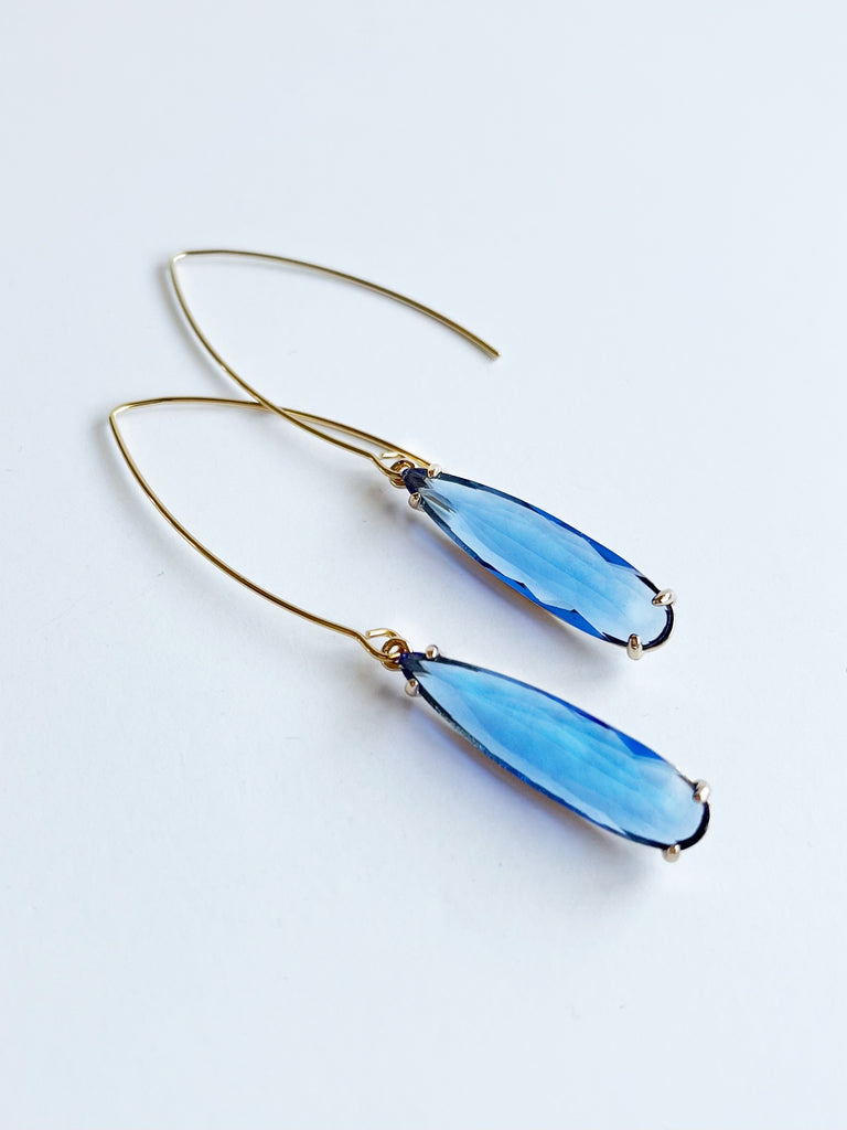 blue teardrop earrings with gold setting 