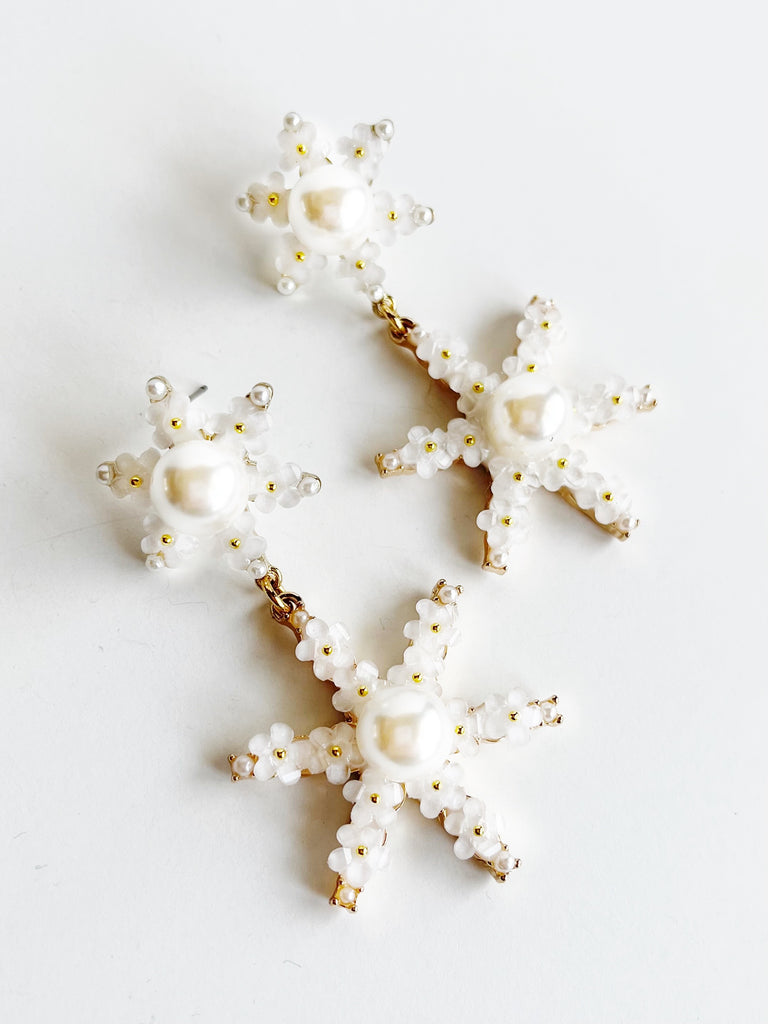 Pearl and Flower Star Pendant Statement Earrings on white background