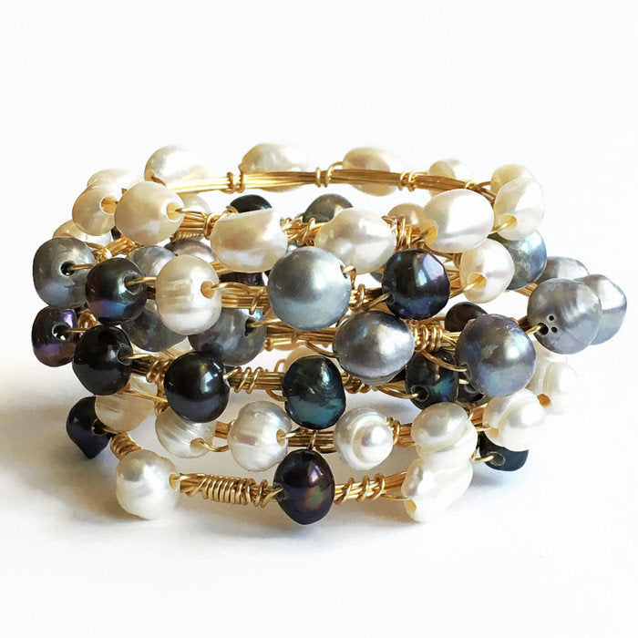 Pearl and Gold Bangle Bracelets stacked together with multi colored pearls