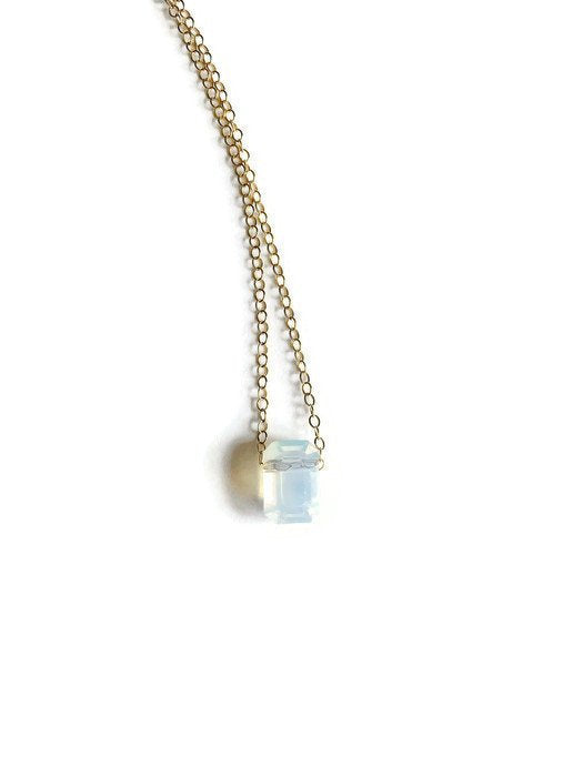 white opal octagon pendant on gold chain