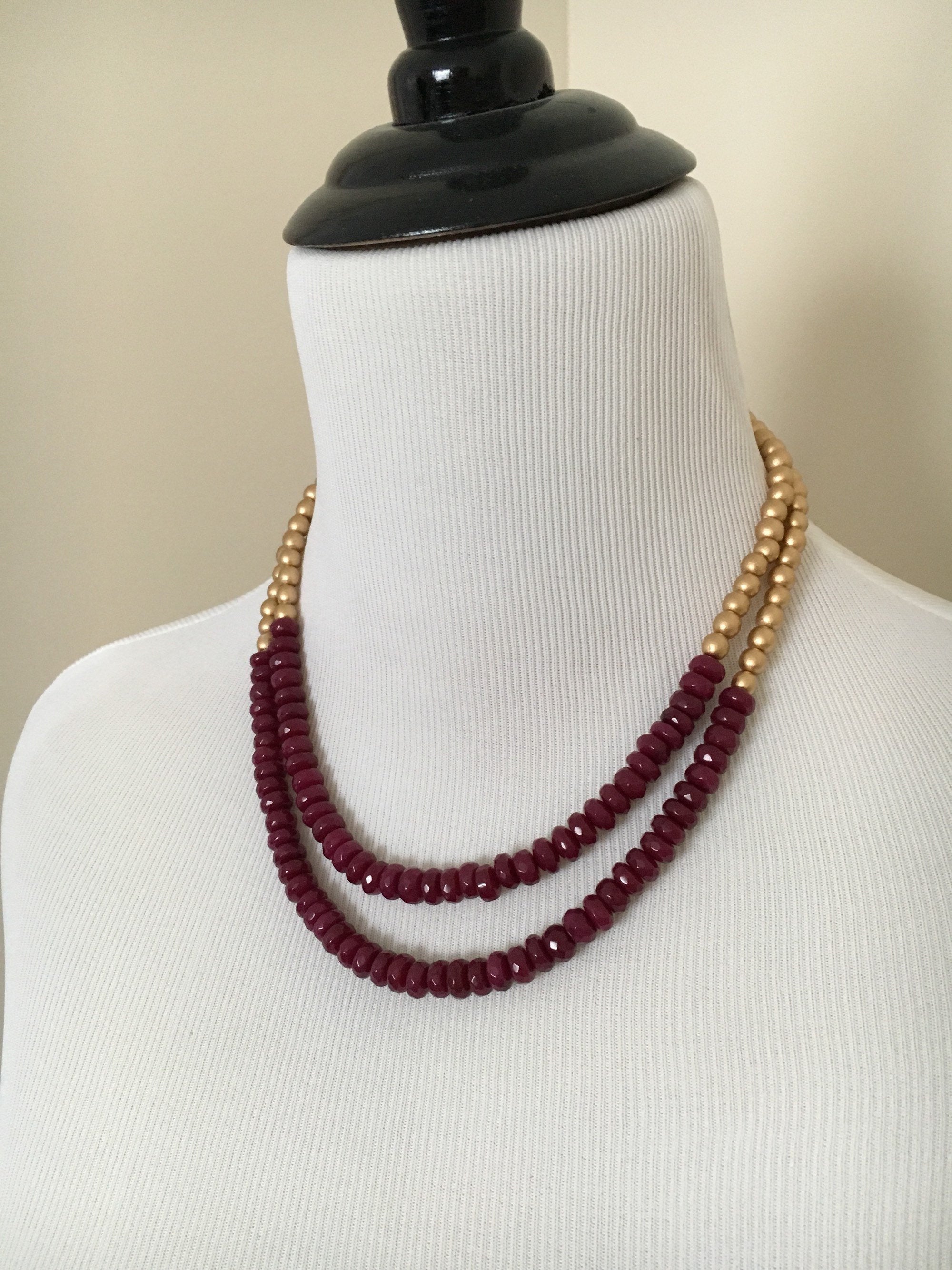 Mannequin wearing Two Stranded Pink and Gold Statement Necklace from the side.