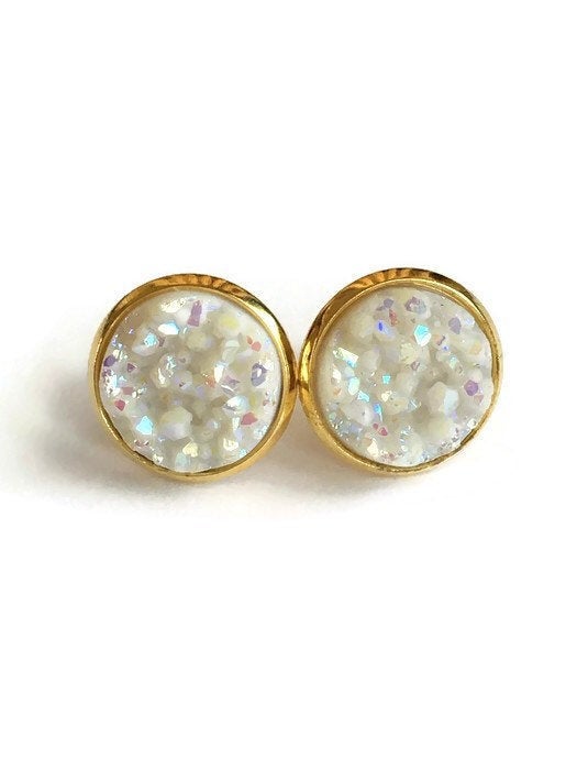White resin druzy stone set in a yellow gold color setting stud earring.