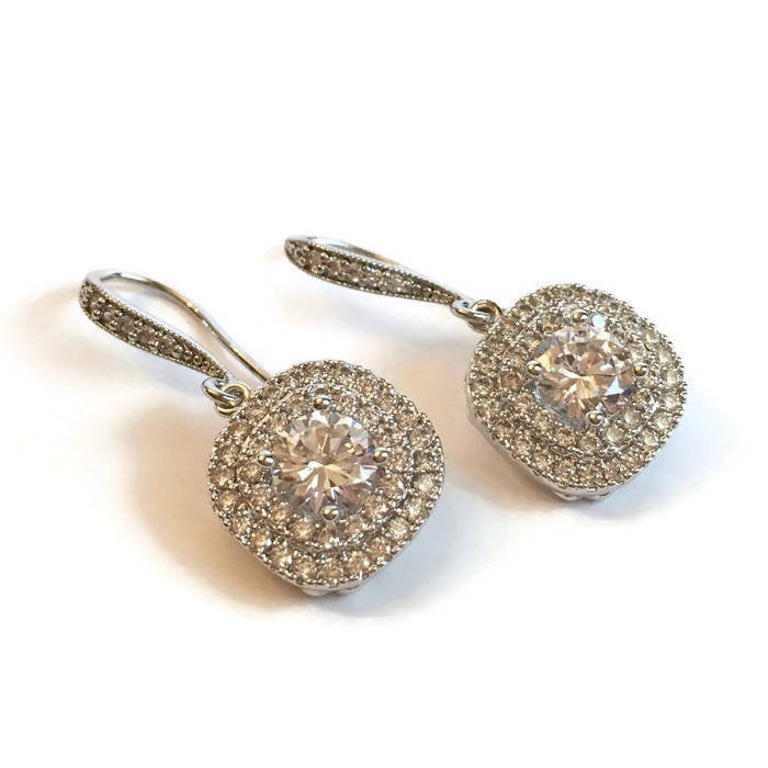 Crystal Cubic zirconia crystal earrings in a silver colored rhodium plated brass setting. 