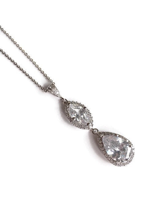 Cubic zirconia crystals set in silver color rhodium plated brass pendant necklace.