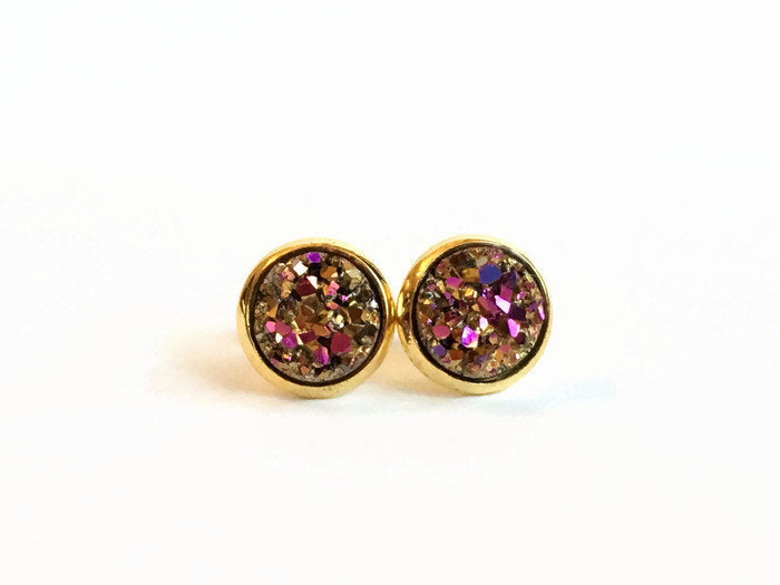 Pink and gold resin druzy stone stud earrings set in a yellow gold color setting