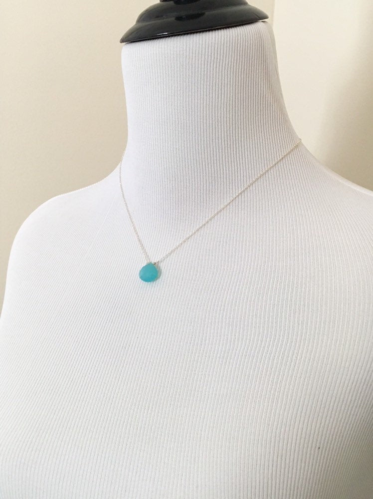 Mannequin wearing Aqua Chalcedony Teardrop Pendant Necklace with Sterling Silver Chain from sideview.