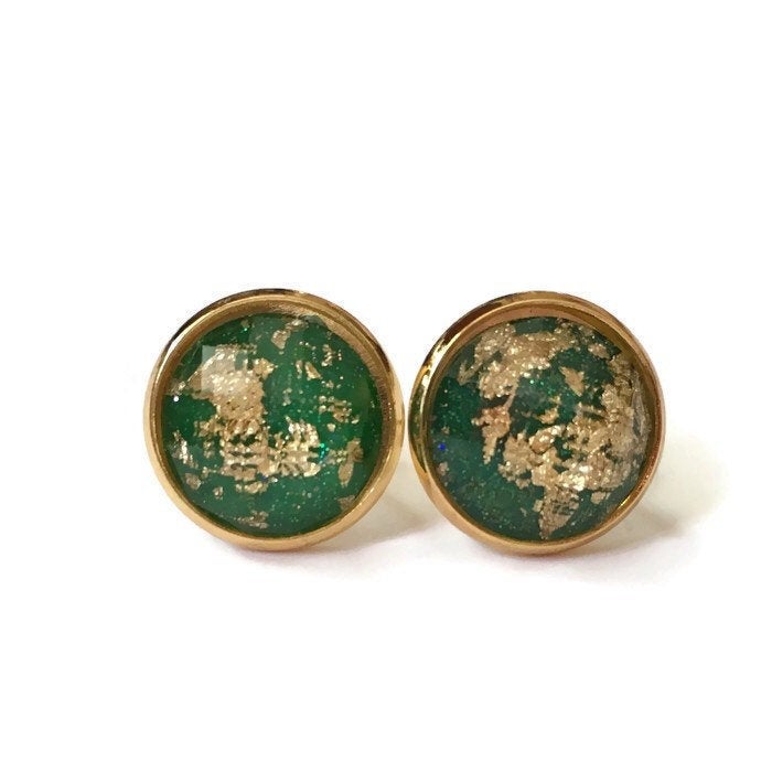 Emerald green with gold leaf resin stone stud earrings in yellow gold color setting close up.