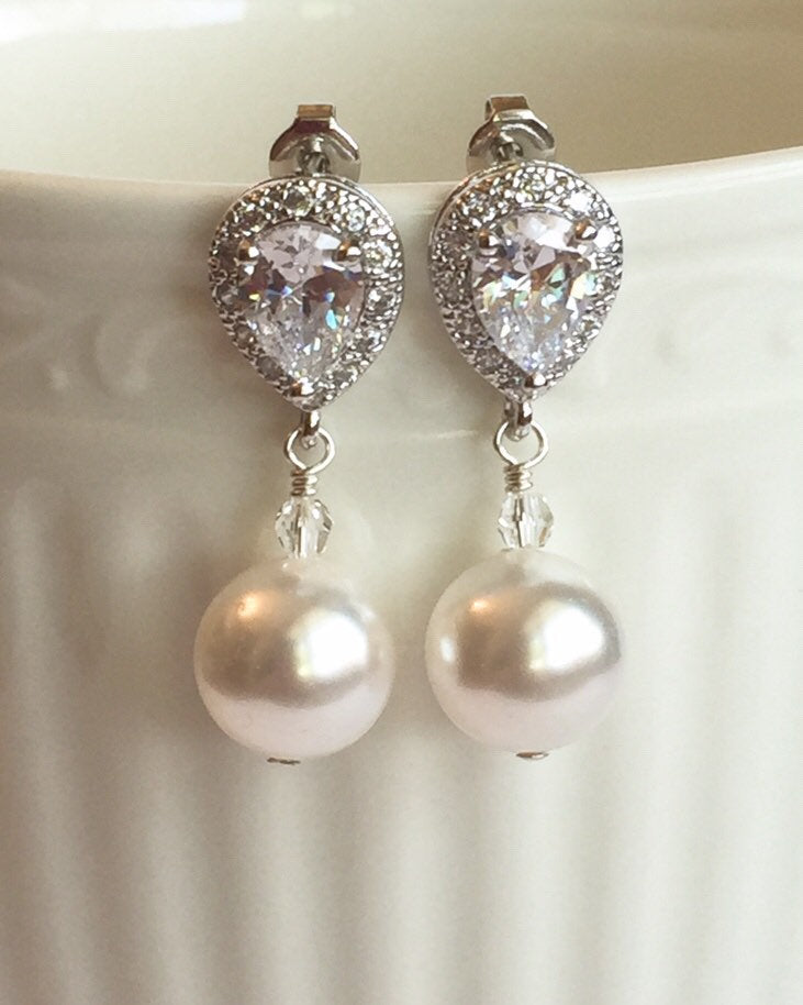 White pearl drop earrings with a cubic zirconia stud