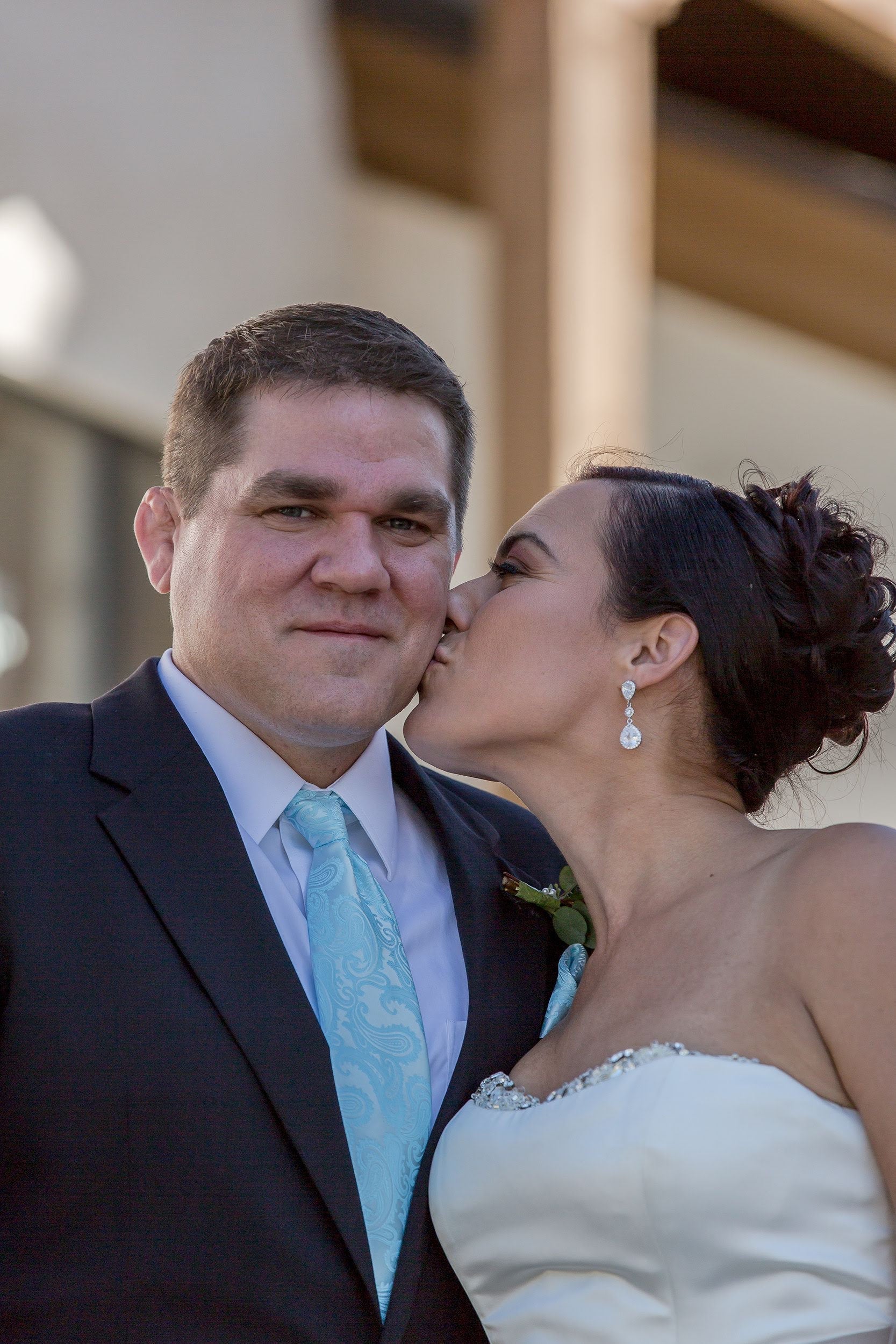 Bride wearing Long Crystal Cubic Zirconia Teardrop Earrings in a silver colored rhodium plated brass setting. in her wedding.