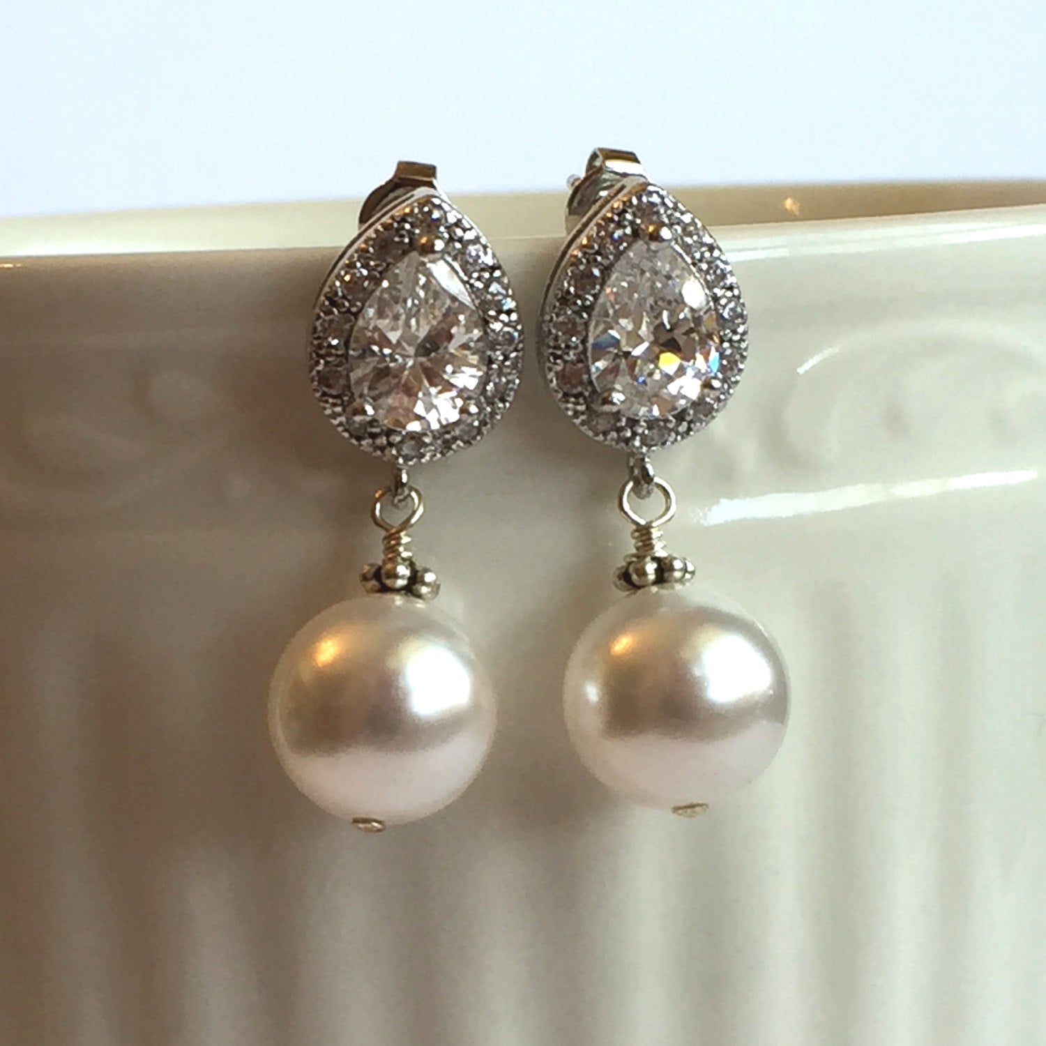 close up of White Pearl and Crystal cubic zirconia Drop stud Earrings 