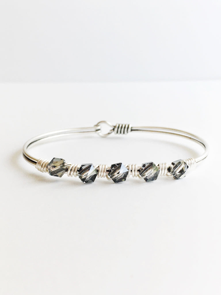 Hand wired grey crystals and silver bangle bracelet. 