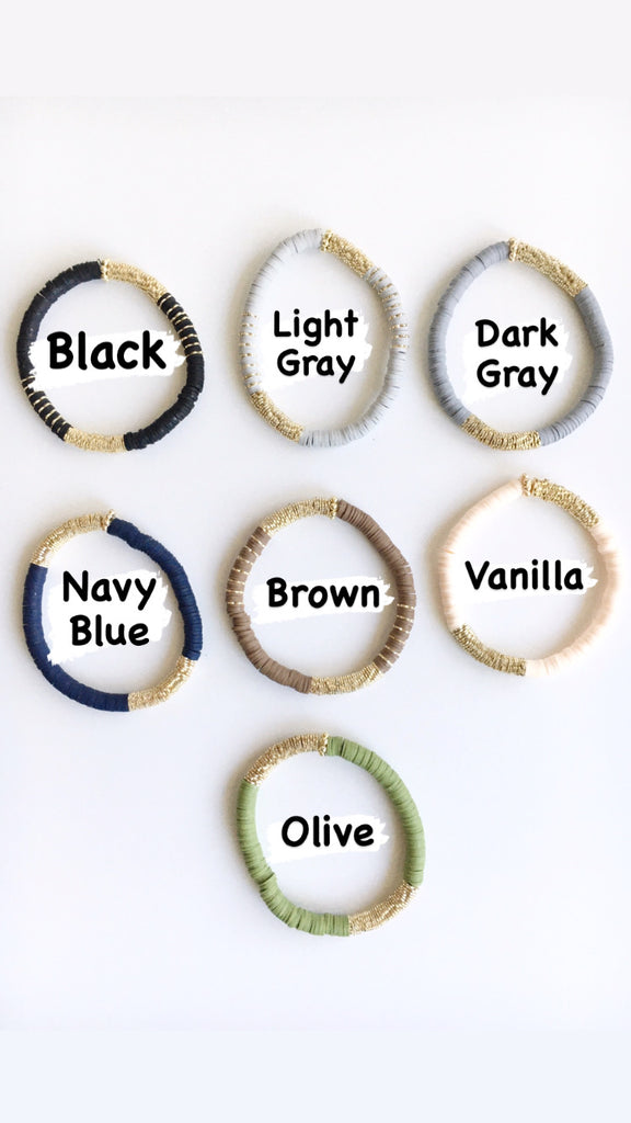 Top view of stretch beaded bracelets in Black, Light gray, dark gray, navy blue, brown, vanilla, and olive.