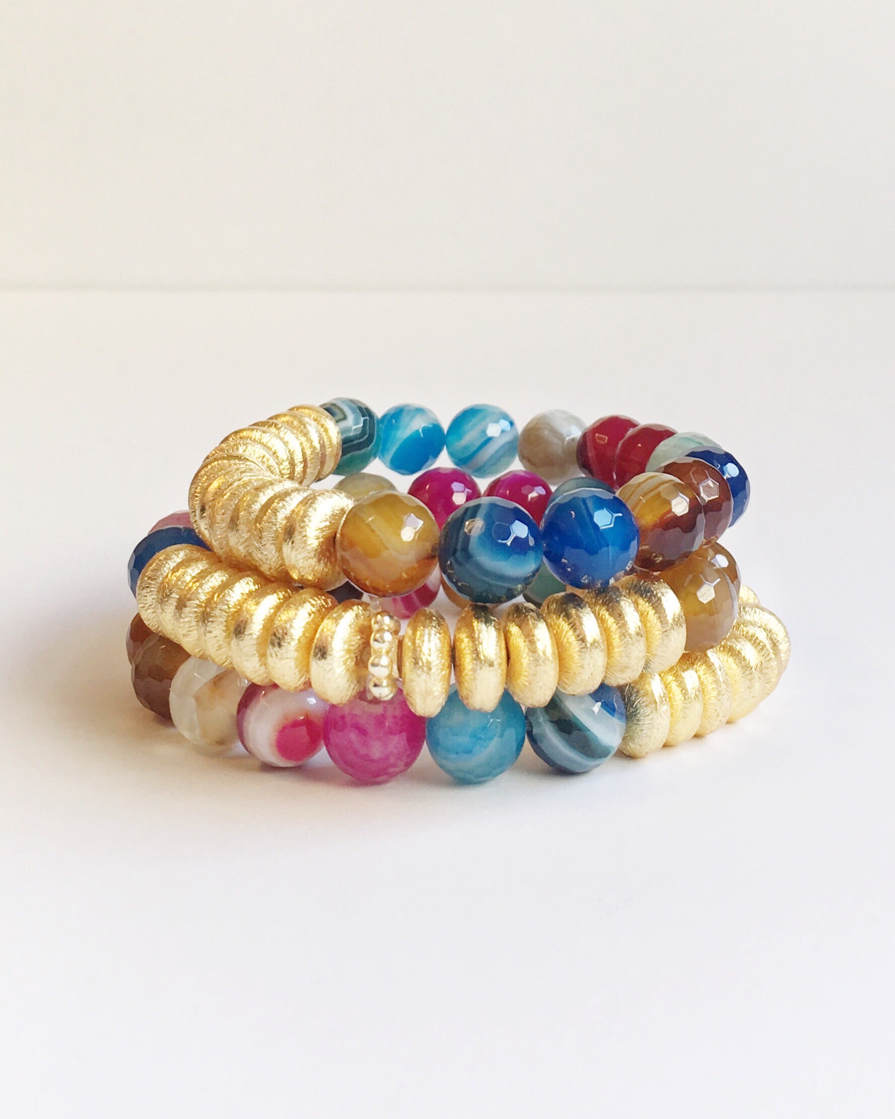 Three Multi Color Agate and Gold Agate Stacking Beaded Bracelets stacked