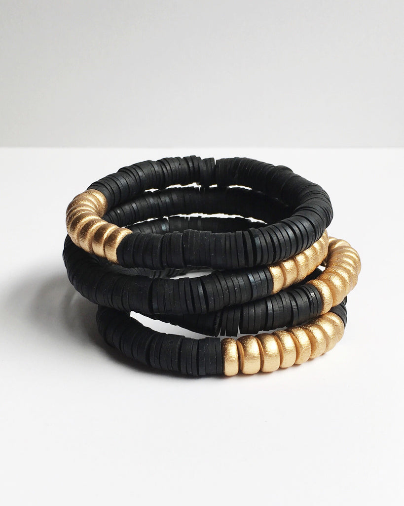 Four Black Confetti & Gold Beaded Stretch Bracelets stacked.