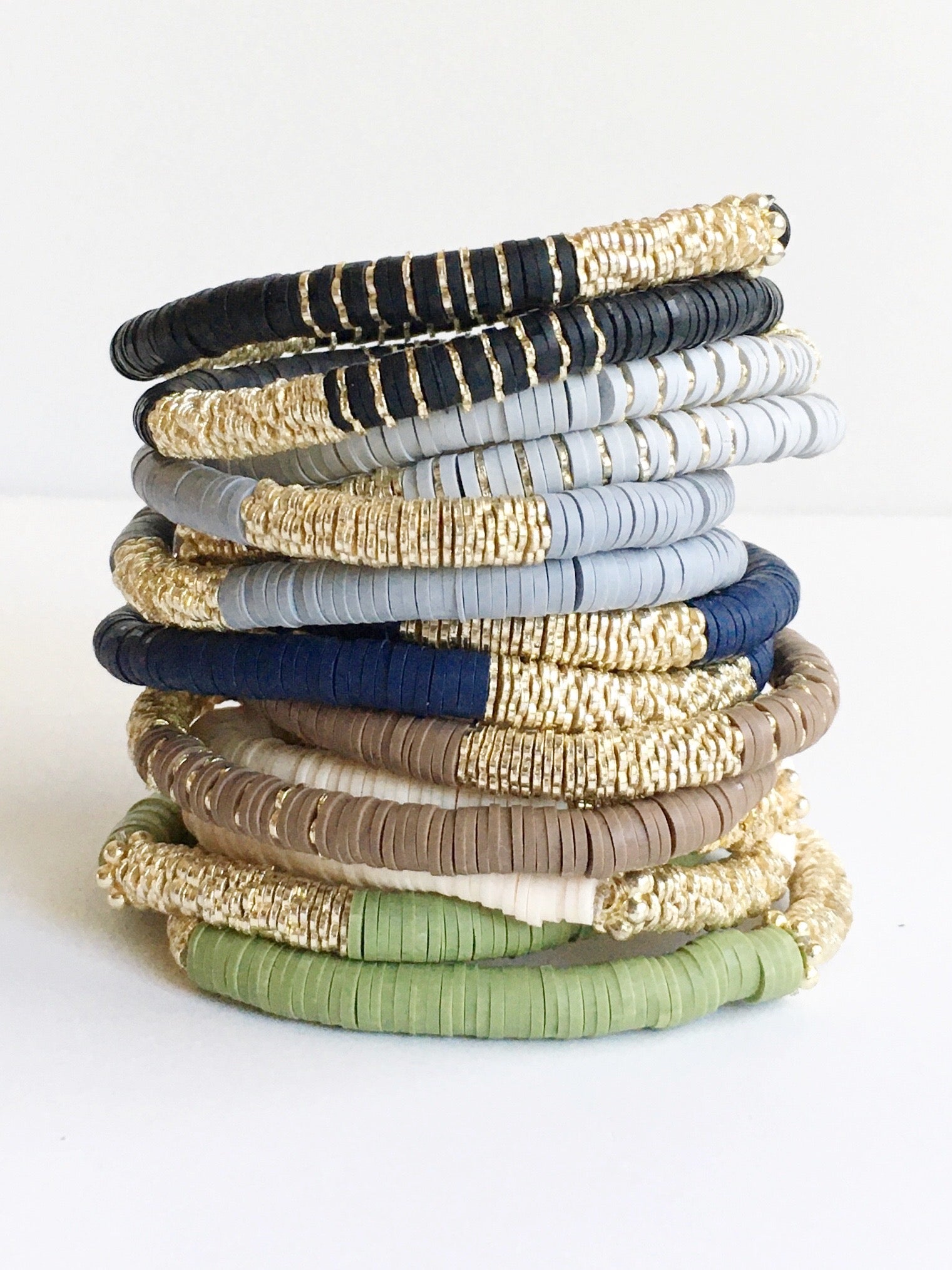 Confetti and Gold Beaded Stretch Bracelets shown in black, grey, white, navy blue, beige, and sage.