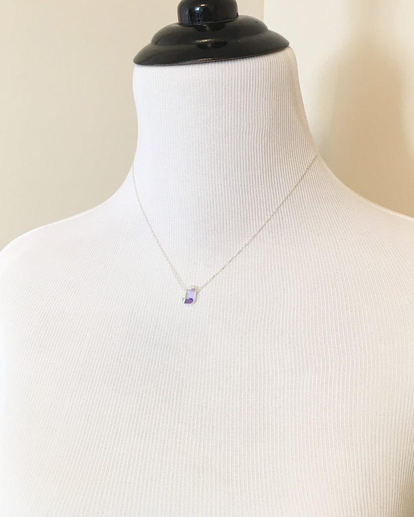 Mannequin wearing Small Clear Crystal pendant on Silver chain Necklace