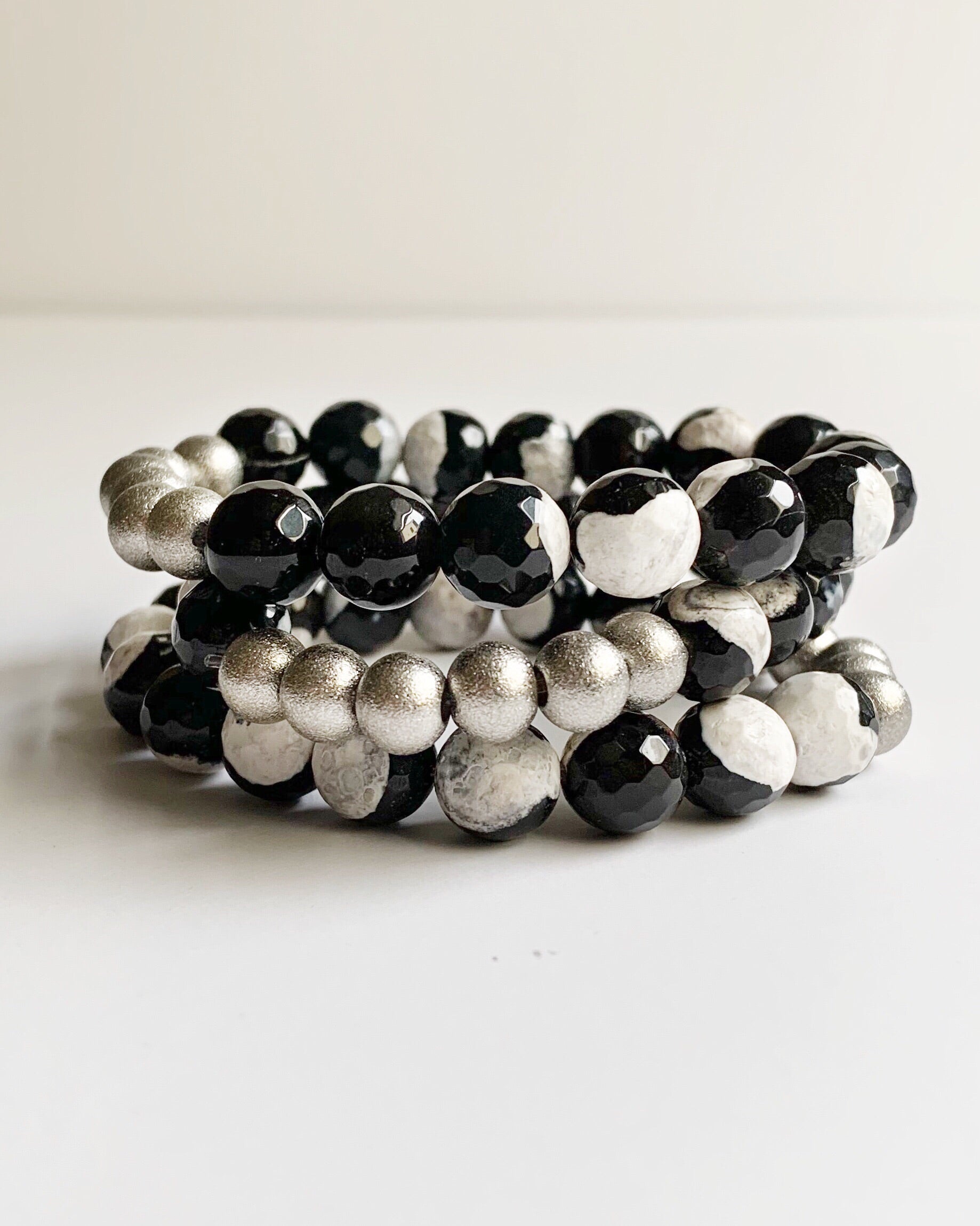 Three Black and White Agate with Silver Stacking Beaded Stretch Bracelets stacked.