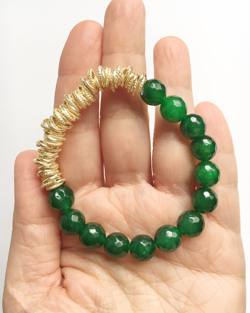 Hand holding Green Agate and Gold Stacking Beaded stretch Bracelet