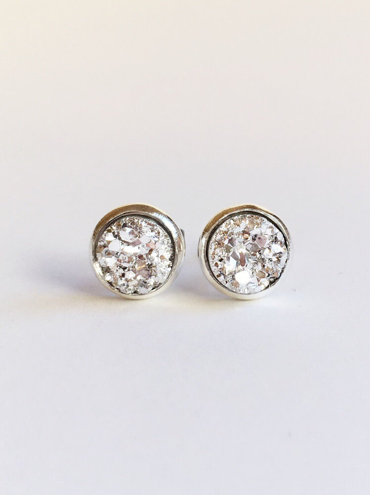 Silver resin druzy stone stud earring set in a stainless steel setting. 