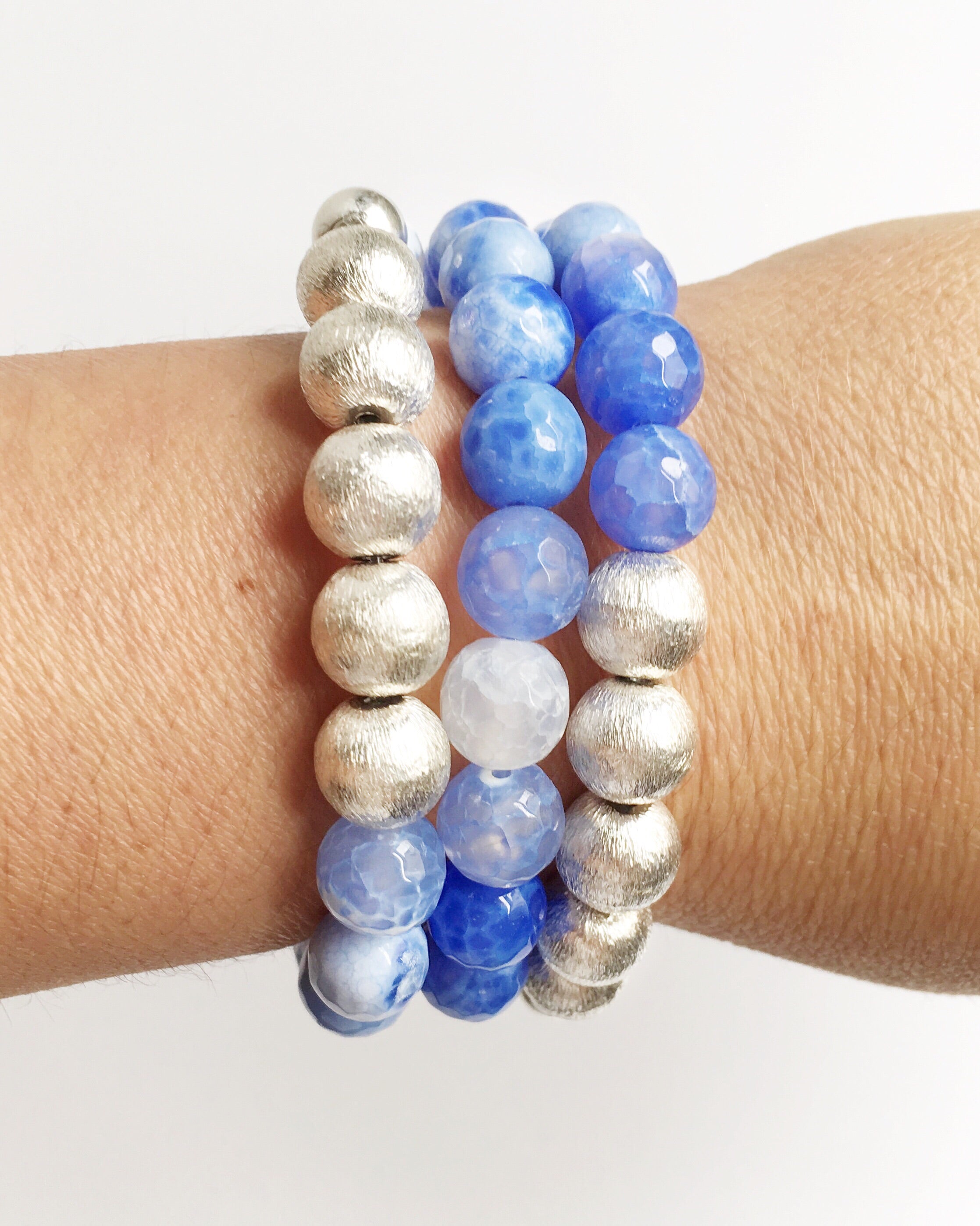 Three White and Blue Lace Agate and Silver Stacking Beaded Bracelets on women's wrist