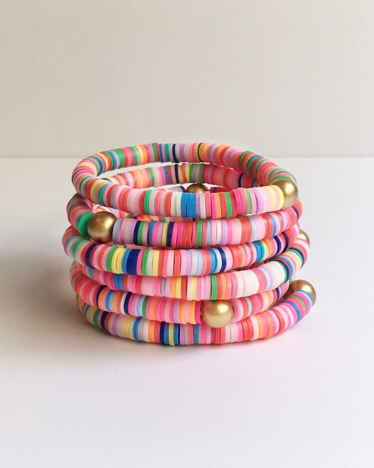 Stack of Rainbow Confetti vinyl and wood Beaded Bracelets