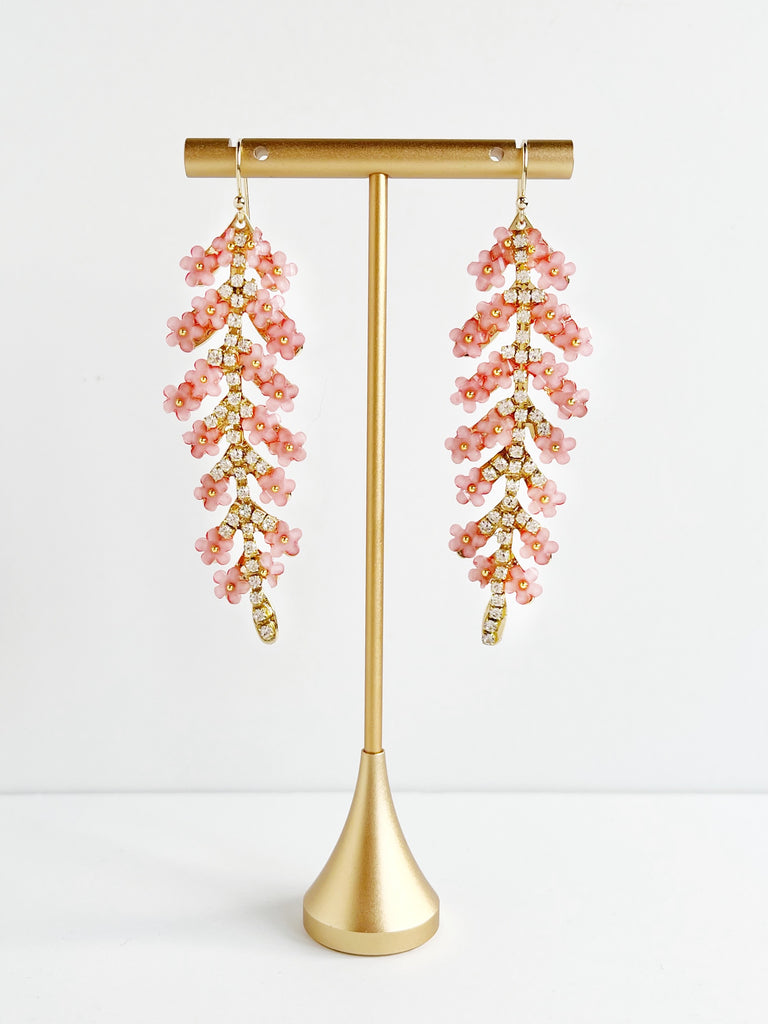 pink and gold bridesmaid drop earrings on gold stand