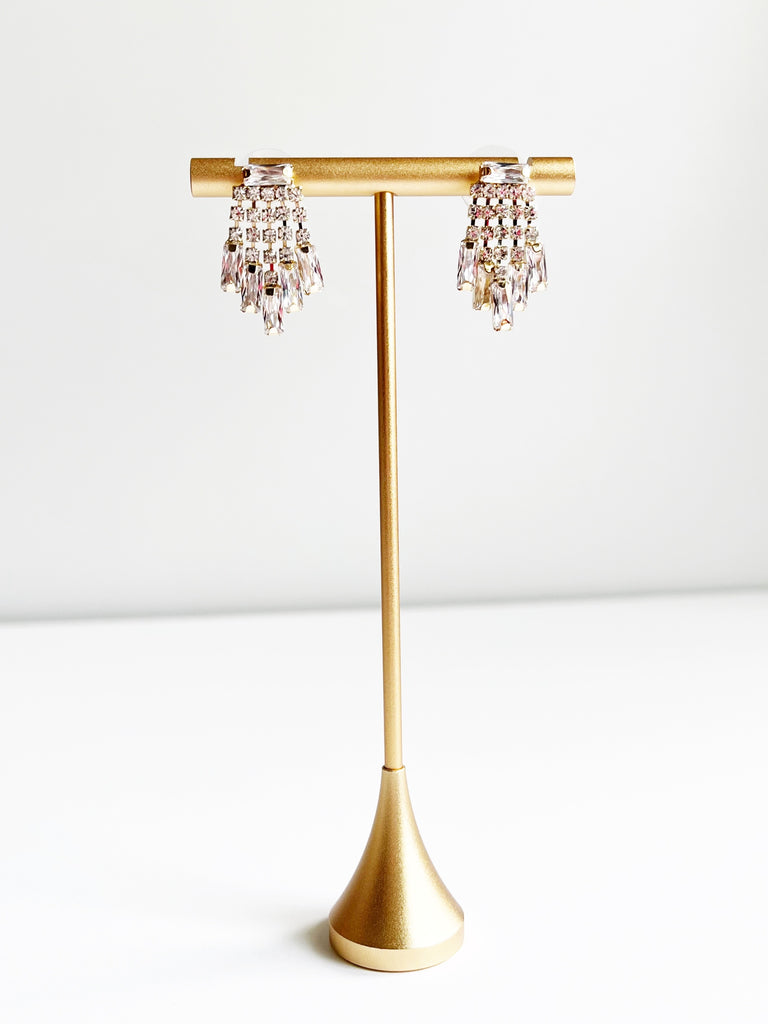 Crystal Earrings displayed on gold jewelry tstand