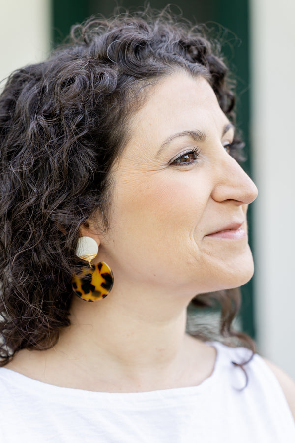 statement earrings on woman